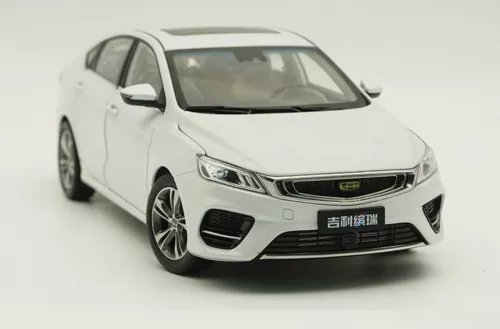 White diecast sedan toy model car, front three-quarter view