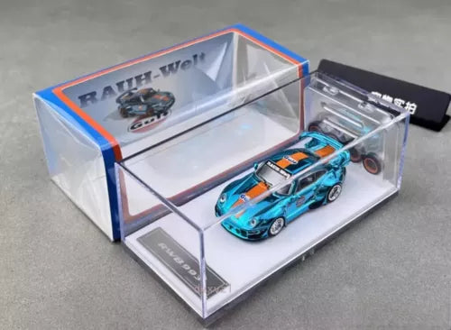 Diecast metal race car toy, teal-blue body, in clear display box