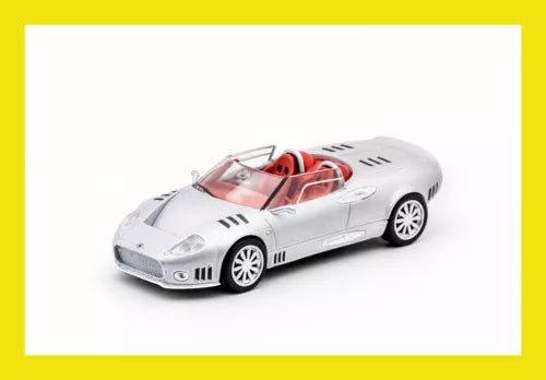 Silver diecast model supercar with red interior, front three-quarter view