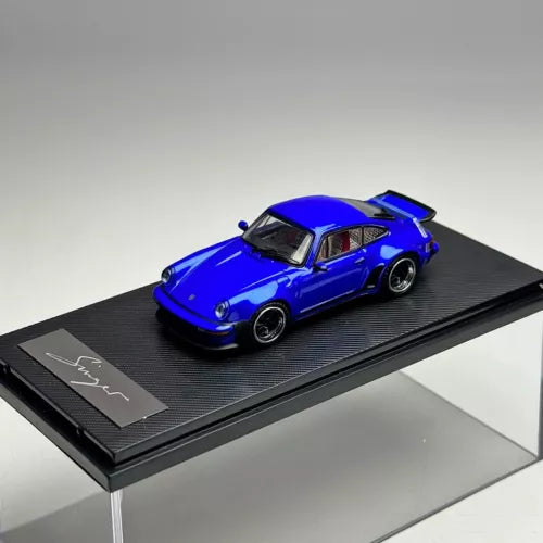 Blue diecast sports car model on black display base, 1:64 scale