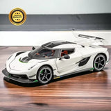 White 1:24 diecast alloy toy car model with black accents, front view, green detail wheels