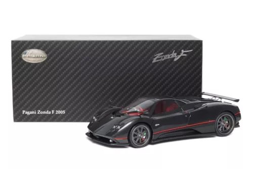 Diecast sports car model in black with red stripe and carbon-fiber detailing