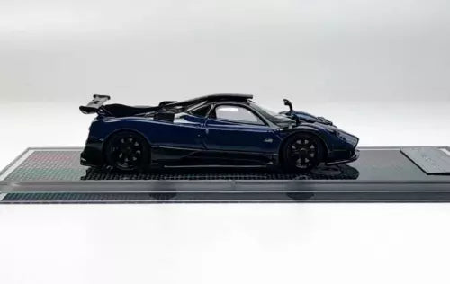 1:64 scale blue racing sports diecast car model with rear spoiler