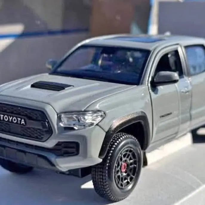TOYOTA Tacoma TRD Pro 1:24 die-cast pickup, light gray front quarter with off-road tires