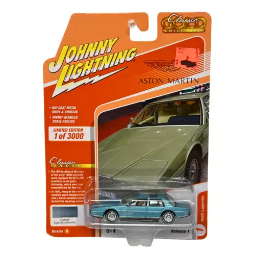 1:64 diecast Aston Martin model car in blister packaging, teal with black wheels