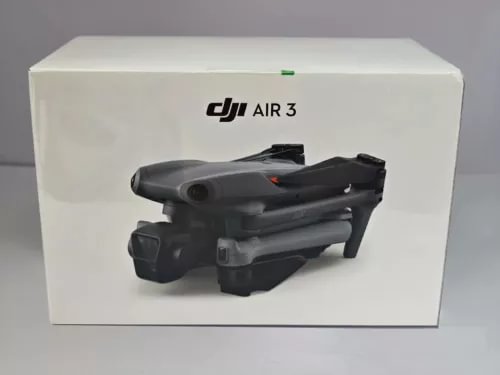 DJI Air 3 drone in white retail box, black quadcopter