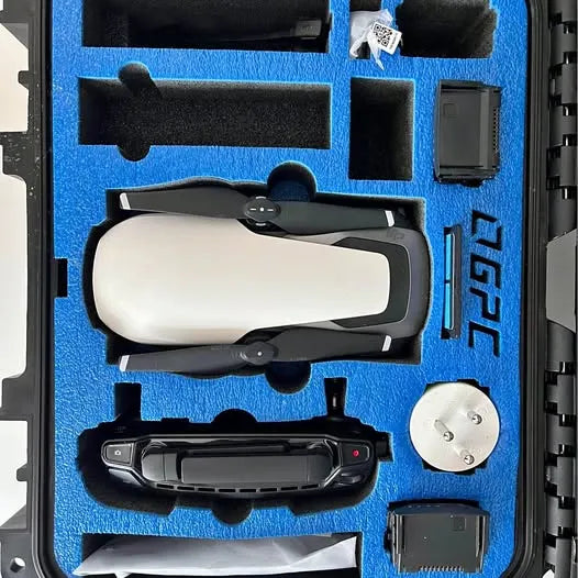 Professional drone case with blue foam insert holding white and black drone