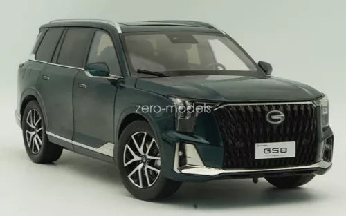 Green 1/18 scale diecast SUV model car, front grille and headlights view