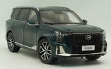 Green 1/18 scale diecast SUV model car, front grille and headlights view