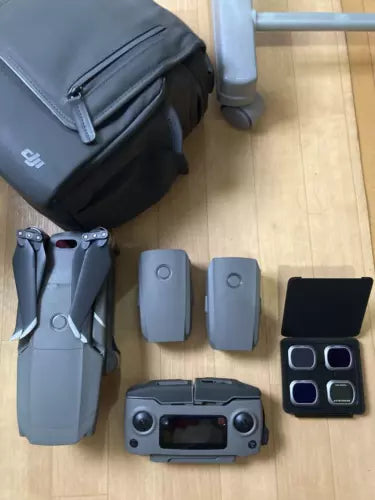 Drone with batteries, charging case, and carrying bag, black and gray