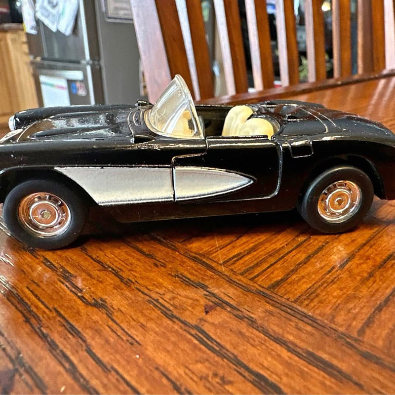 Black 1:39 scale 1957 Chevrolet Corvette diecast toy car, front side view