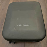 Hard-shell drone case in dark gray, front logo, zipper edge visible