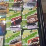 Diecast model car lot in blister packs, Johnny Lightning and Pontiac designs.