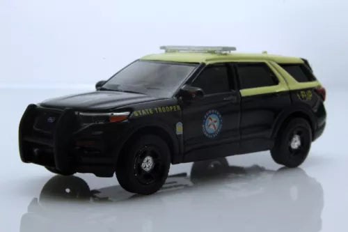 Police SUV diecast model with black body and green roof, front three-quarter view