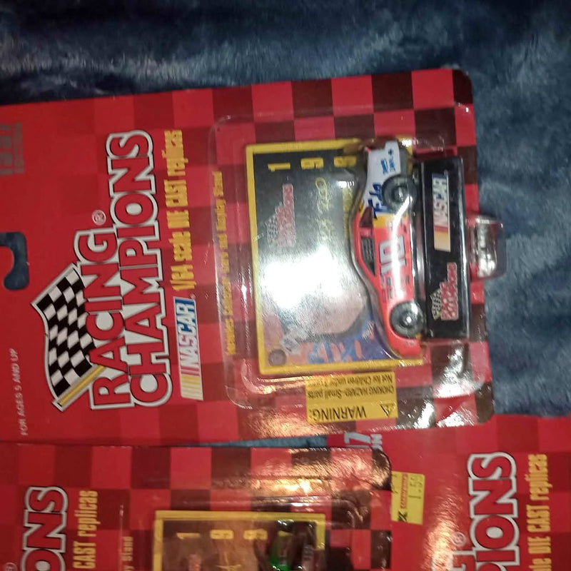 NASCAR Racing Champions diecast car in red checkered blister package