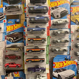 Hot Wheels diecast car blister packs showing multiple car models