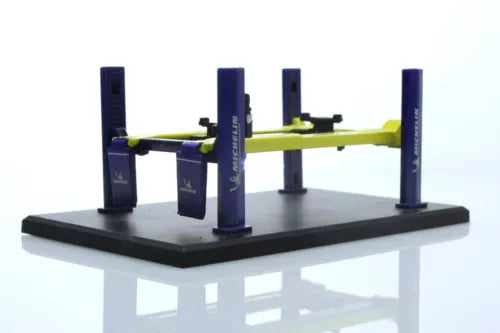 Michelin car lift diecast working model with black platform and four blue posts, green arms