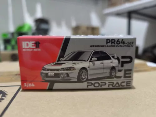 Mitsubishi Lancer Evolution IV diecast model car, grey on display box