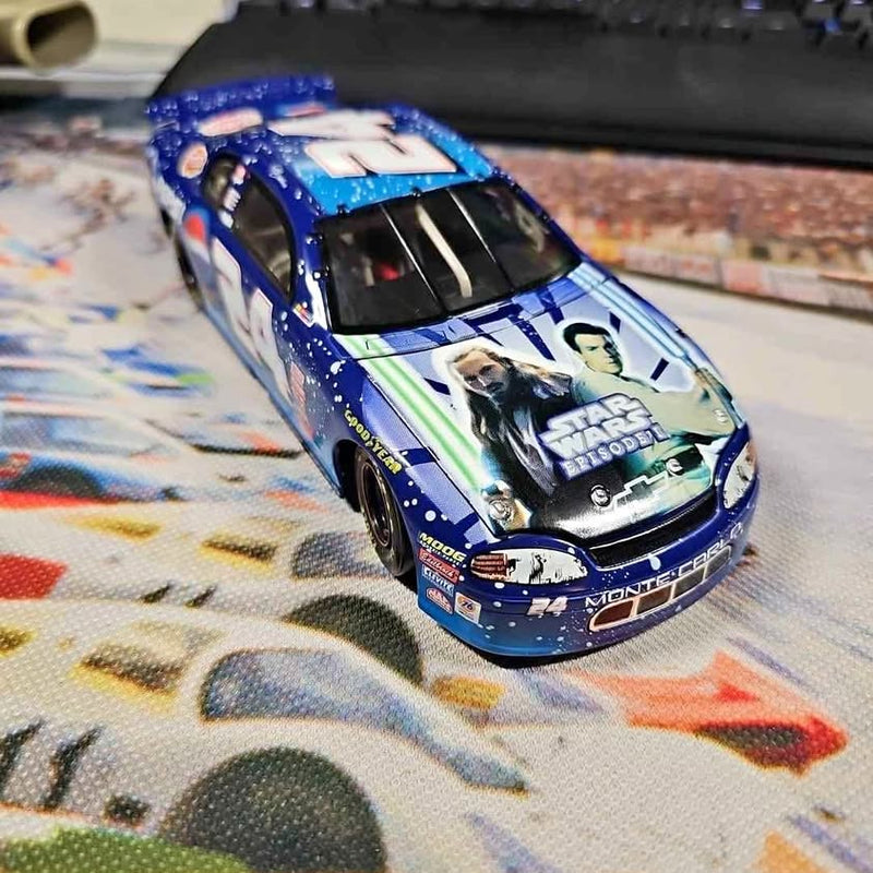 Blue and white 1:24 diecast race car with Star Wars graphics, front 3/4
