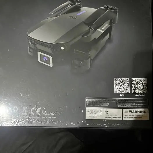 Compact drone body with front camera lens and underside label panel