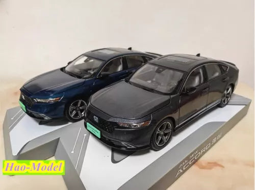 1:18 diecast model car set with dark and blue sedans, front 3/4 view