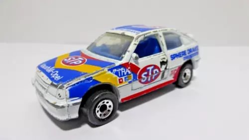 Diecast race car model with blue and white body, red stripe decals, detailed wheels
