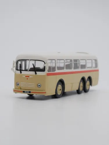 Diecast toy bus model in cream with red stripe, front view, 1:72 scale