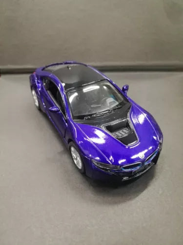 Purple diecast toy car model with detailed front grille and headlights
