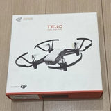 Tello quadcopter drone box with four-armed drone and folded propellers