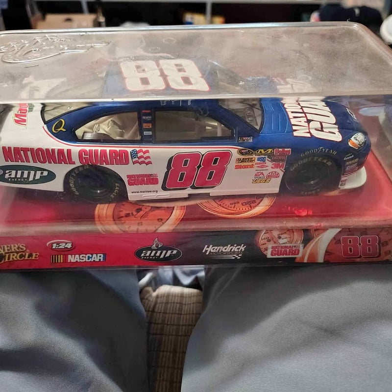 Blue NASCAR diecast race car with white #88 on hood, in clear retail box