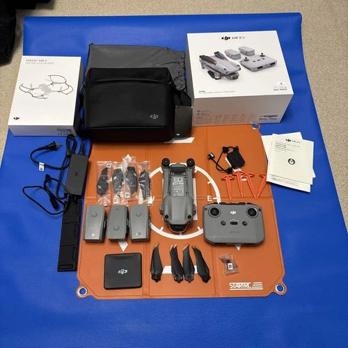 Drone Fly More combo kit with controller, multiple batteries, propellers, charger and case
