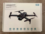 Collapsible quadcopter drone with 1080P HD FPV camera shown on retail box