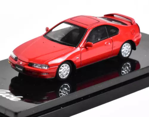 Red diecast sports coupe model car with silver wheels, 1:64 scale
