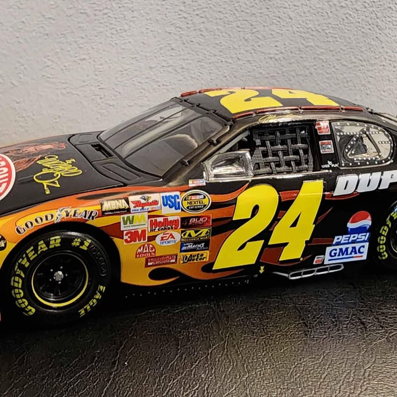 1:24 scale diecast race car, black and yellow with number 24 decals.