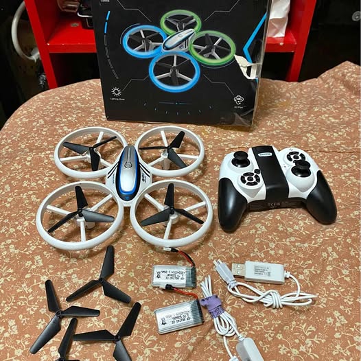 Kids drone with controller and batteries, four propeller arms