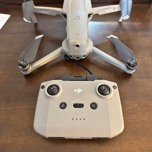 DJI Mavic Pro drone with remote controller, front view and landing gear
