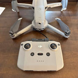 DJI Mavic Pro drone with remote controller, front view and landing gear