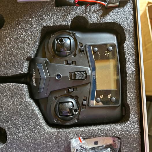 Drone controller with LCD screen and dual joysticks in a black case