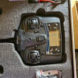 Drone controller with LCD screen and dual joysticks in a black case