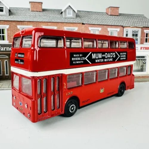 Red diecast bus model with front grille and side windows