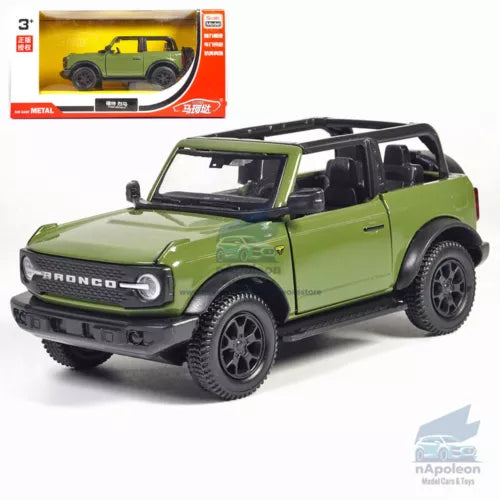 Green Ford Bronco diecast model car with black soft top, front 3/4 view