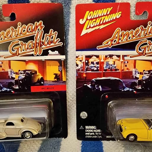 Diecast model car set in blister packaging, yellow and cream cars