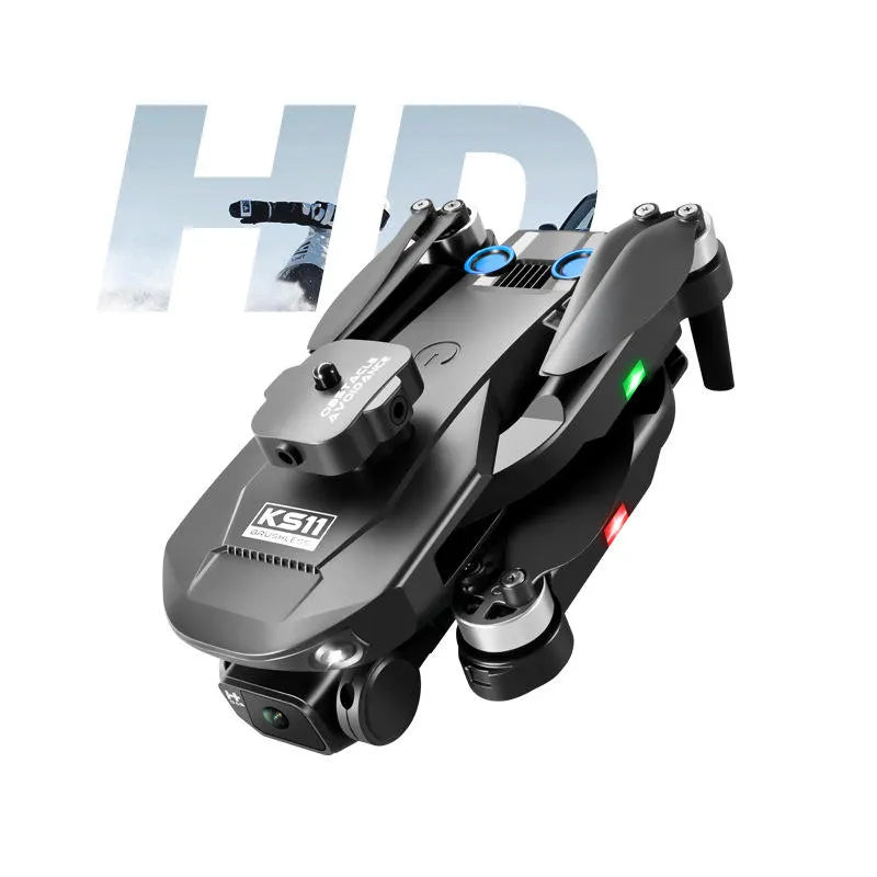 Camera-equipped quadcopter drone with grey and black body, front lens, folding arms.
