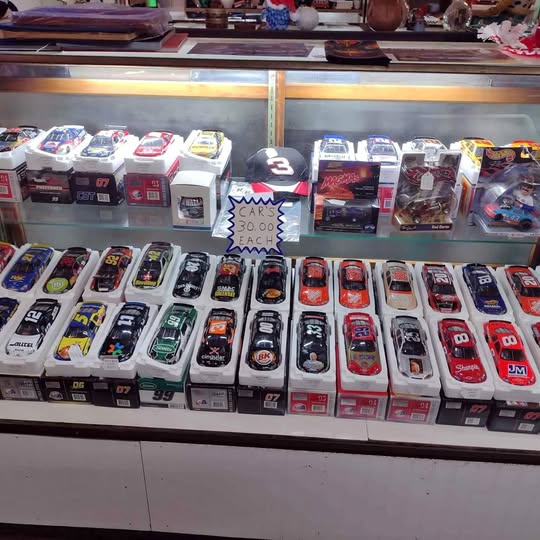 Boxed NASCAR diecast race cars set, many colorful 1:24 models on display