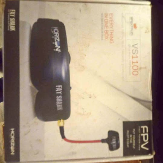 FPV first-person camera setup box with black camera module and red cable