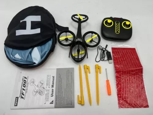 Yellow mini RC helicopter drone kit with controller, prop guards, tools and manual