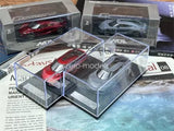 Red and gray 1:64 scale diecast toy cars in clear display boxes