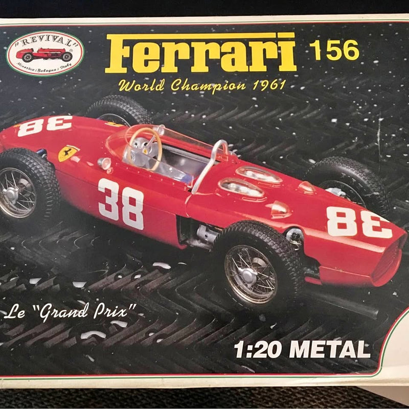 Red Ferrari race car diecast model, number 38, 1:20 metal, front 3/4 view