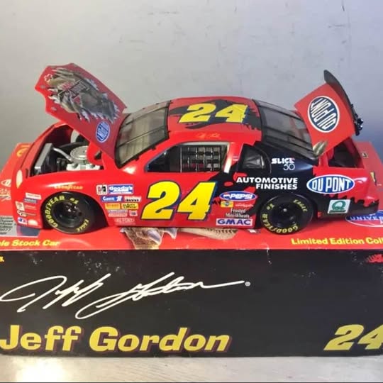 1:24 diecast race car, red/black #24 with sponsor decals and Jeff Gordon
