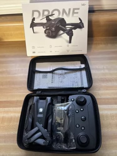 Drone with camera kit in zip case with controller, prop guards, and spare parts